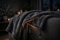 KAVRYNEX USB Heated Blanket draped over a couch